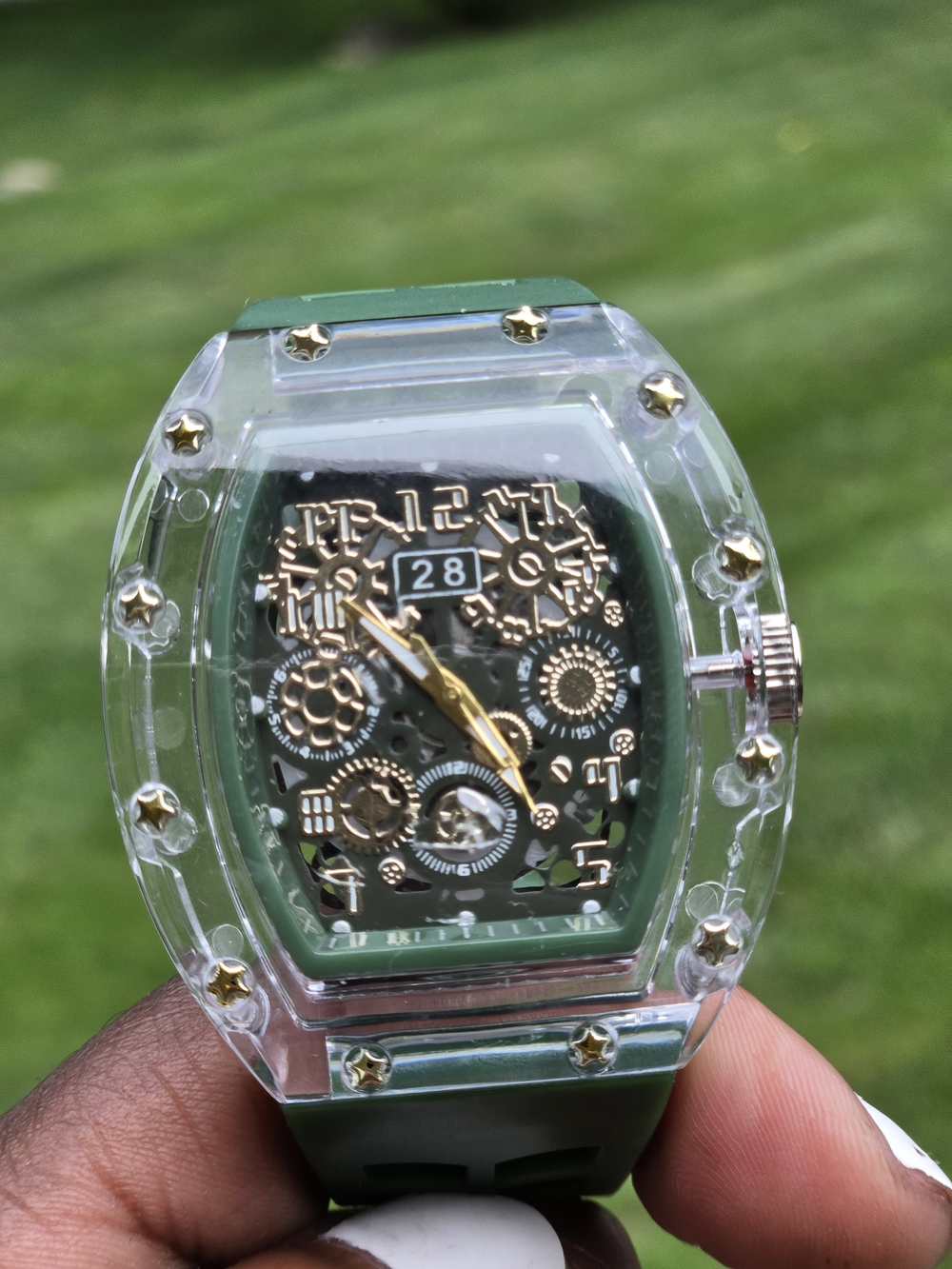 Clear Case Green Dial Mechanical-Style Watch with Gold Accents